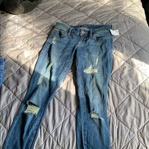 Lucky Brand skinny ripped jeans.